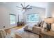 Bright bedroom featuring hardwood floors, a ceiling fan, and large windows at 333 Mimosa Dr, Decatur, GA 30030