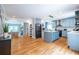 Open layout with living room, kitchen, and kitchen island with pendant lighting at 333 Mimosa Dr, Decatur, GA 30030