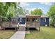Beautiful backyard featuring a multi-tiered deck and lush greenery, creating a private outdoor oasis at 1222 Crestwood Se Dr, Atlanta, GA 30316
