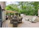 Backyard deck with dining area, multiple seating areas, and a view of the fenced-in yard at 1222 Crestwood Se Dr, Atlanta, GA 30316