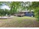 Expansive backyard with multiple decks, a fire pit, and ample space for outdoor activities and relaxation at 1222 Crestwood Se Dr, Atlanta, GA 30316