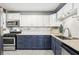 Updated kitchen featuring stainless steel appliances and two-tone cabinets at 1222 Crestwood Se Dr, Atlanta, GA 30316