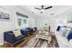 Bright living room features hardwood floors, a ceiling fan, and large window at 1222 Crestwood Se Dr, Atlanta, GA 30316