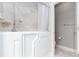 A bathroom featuring a walk-in tub and neutral tile flooring at 1640 Arbor Green Nw Ct # 1102, Kennesaw, GA 30152