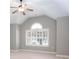 A bedroom featuring vaulted ceilings, neutral walls and carpet, and a window at 1640 Arbor Green Nw Ct # 1102, Kennesaw, GA 30152