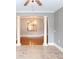 Open bonus room with tile floors, white columns, view to kitchen, and natural light at 1640 Arbor Green Nw Ct # 1102, Kennesaw, GA 30152