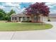 Charming brick home with a well-manicured lawn and mature landscaping at 1640 Arbor Green Nw Ct # 1102, Kennesaw, GA 30152