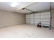 Spacious garage features clean epoxy flooring and an insulated garage door at 1640 Arbor Green Nw Ct # 1102, Kennesaw, GA 30152