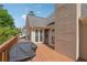 Beautiful back porch with a grill, multiple windows, and a wooden fence at 2849 Shiaway Trl, Snellville, GA 30039