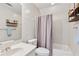 Bathroom featuring a shower-tub combination, a toilet and a sink with mirror at 2849 Shiaway Trl, Snellville, GA 30039