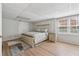 Bedroom in a basement featuring a bed, a nightstand and two bright, window views at 2849 Shiaway Trl, Snellville, GA 30039