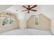 Bedroom with vaulted ceilings, two windows, and neutral carpeting at 2849 Shiaway Trl, Snellville, GA 30039