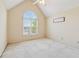 A cozy bedroom features an arched window, high ceilings, and neutral carpeting at 2849 Shiaway Trl, Snellville, GA 30039