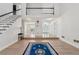 Spacious foyer boasts hardwood floors, a modern staircase, and an elegant entrance, creating a welcoming ambiance at 2849 Shiaway Trl, Snellville, GA 30039