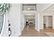 Welcoming foyer with views of the living room and fireplace beyond at 2849 Shiaway Trl, Snellville, GA 30039