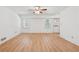 Empty living room with hardwood floors, two windows and back door at 2849 Shiaway Trl, Snellville, GA 30039
