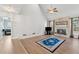 Inviting living room featuring a stone fireplace, vaulted ceilings, wood floors, and large windows at 2849 Shiaway Trl, Snellville, GA 30039