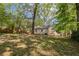 Wide shot of a backyard featuring a house and fenced perimeter, ideal for outdoor activities at 3417 Glen Rd, Decatur, GA 30032