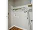 A functional laundry room with hardwood floors and utility connections, ready for appliances at 3417 Glen Rd, Decatur, GA 30032