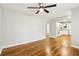 Clean space with hardwood floors, neutral paint, ceiling fan, and easy access to the kitchen at 3417 Glen Rd, Decatur, GA 30032
