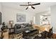 Cozy, virtually staged living room with neutral colors, hardwood floors, and a kitchen view at 3417 Glen Rd, Decatur, GA 30032