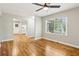 Bright room featuring hardwood floors, a ceiling fan, and an open floor plan at 3417 Glen Rd, Decatur, GA 30032
