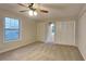 Spacious bedroom with plush carpeting, large closet, and arched doorway to en-suite bathroom at 3640 Sapphire Ct, Decatur, GA 30034