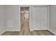Hallway with laminate flooring and access to closets and other rooms at 3640 Sapphire Ct, Decatur, GA 30034