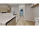 Bright kitchen features stainless steel appliances, quartz countertop and laminate floor at 3640 Sapphire Ct, Decatur, GA 30034