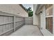Enclosed patio with gray fence, sliding glass door, and exterior of the home at 3640 Sapphire Ct, Decatur, GA 30034