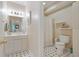Traditional bathroom features a single vanity with black and white tile flooring at 3803 Mill Creek Ct, Atlanta, GA 30341