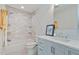 Stylish bathroom with subway tile shower, patterned floor, and modern vanity with silver fixtures at 3803 Mill Creek Ct, Atlanta, GA 30341
