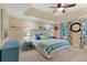 Bright bedroom features a queen bed, tray ceiling, and blue side table at 3803 Mill Creek Ct, Atlanta, GA 30341
