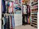 Well-organized walk-in closet with shelving, drawers, hanging rods, and dedicated space for shoes and accessories at 3803 Mill Creek Ct, Atlanta, GA 30341