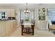 Dining room features a wooden table, elegant chandelier, shuttered windows, and built-in display cabinet at 3803 Mill Creek Ct, Atlanta, GA 30341