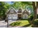 Charming home with a well-manicured lawn, two car garage and mature trees in a beautiful neighborhood at 3803 Mill Creek Ct, Atlanta, GA 30341