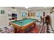 Fun game room with a pool table and bar area perfect for entertaining at 3803 Mill Creek Ct, Atlanta, GA 30341