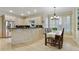 Open concept kitchen with stainless steel appliances, granite countertops, and adjacent dining area at 3803 Mill Creek Ct, Atlanta, GA 30341