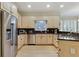 Well-lit kitchen with stainless steel appliances, granite countertops, wooden cabinets, and tiled backsplash at 3803 Mill Creek Ct, Atlanta, GA 30341