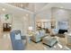 Spacious living room with high ceilings, fireplace, and lots of natural light from large windows at 3803 Mill Creek Ct, Atlanta, GA 30341