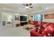 Spacious living room features a large red couch with patriotic decor and plenty of natural light at 3803 Mill Creek Ct, Atlanta, GA 30341