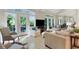 Large living room with hardwood floors, many windows and natural light at 3803 Mill Creek Ct, Atlanta, GA 30341