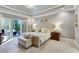 Light-filled bedroom with tray ceilings, private balcony, and plush carpeting for a relaxing retreat at 3803 Mill Creek Ct, Atlanta, GA 30341