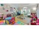Bright playroom with colorful decor, ample storage, and plenty of space for activities and fun at 3803 Mill Creek Ct, Atlanta, GA 30341