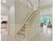 Grand stairway showcasing newel post and carpeted treads leading to the second floor at 3803 Mill Creek Ct, Atlanta, GA 30341