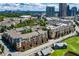 Aerial shot showcases community buildings, lush greenery, nearby skyline and golf course views at 400 17Th Nw St # 1315, Atlanta, GA 30363