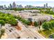 Aerial view of the neighborhood showcasing the community, nearby streets, and surrounding trees at 400 17Th Nw St # 1315, Atlanta, GA 30363