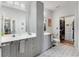 Double vanity bathroom featuring a shower and toilet with grey cabinets and tiled floor at 400 17Th Nw St # 1315, Atlanta, GA 30363
