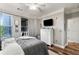 Well-lit bedroom features a large window, TV, and ample space at 400 17Th Nw St # 1315, Atlanta, GA 30363