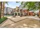 Outdoor area with patio seating, stone pillars, and mature trees at this attractive property at 400 17Th Nw St # 1315, Atlanta, GA 30363